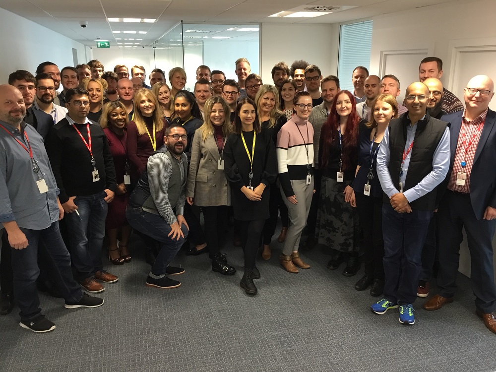 Large group of people in an office.