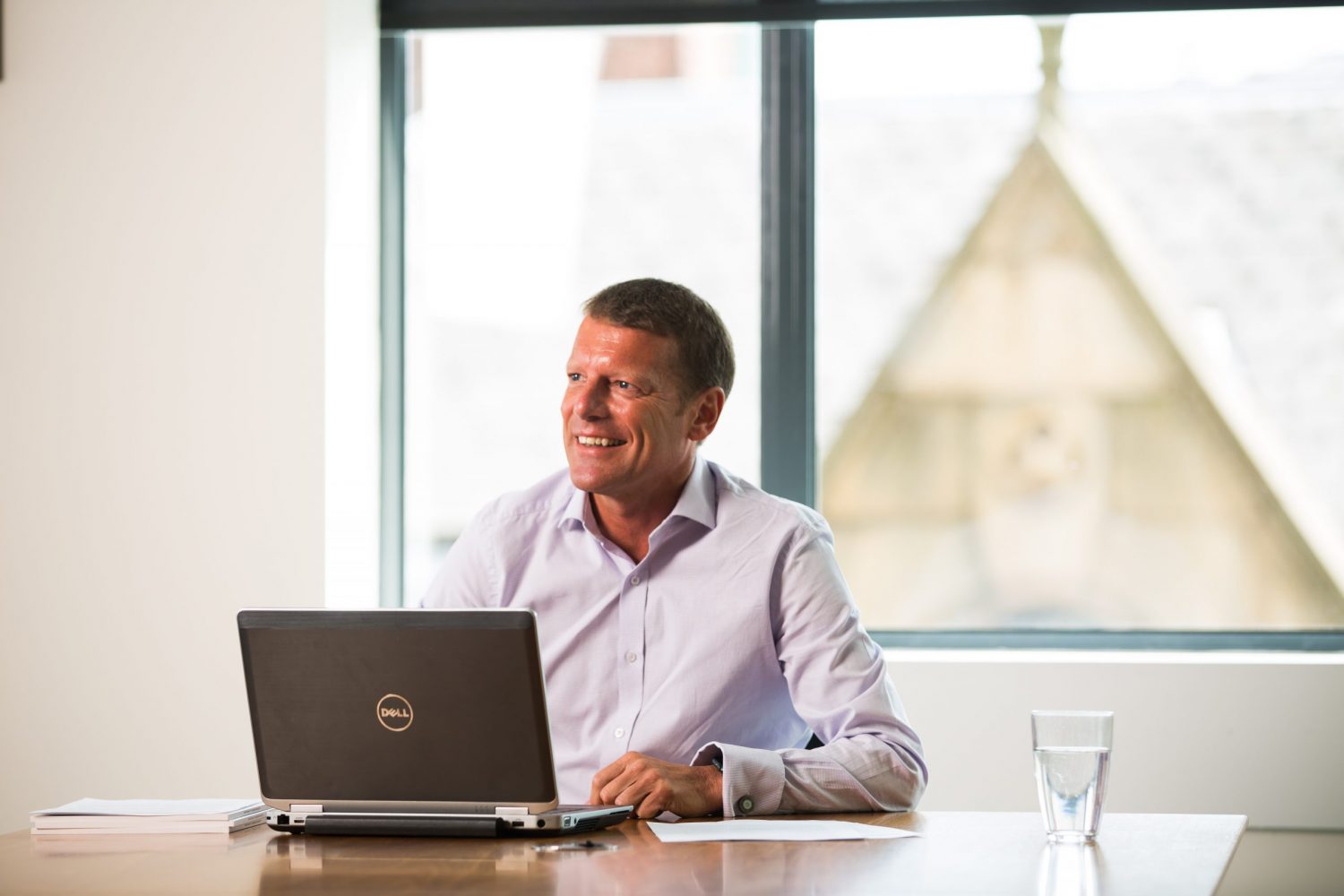 Paul Taberner, Managing Director of Mercia’s Debt Funds, sitting at a table with a laptop